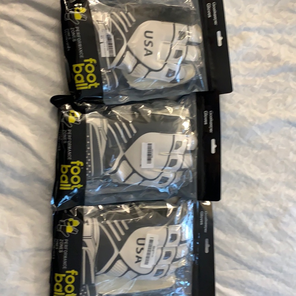 Three pairs goalkeeper gloves new in package for football or soccer